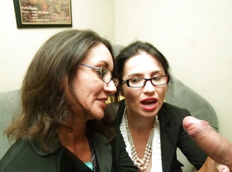 Полностью одетые зрелые красотки в очках по очереди дрочат твердый член 14